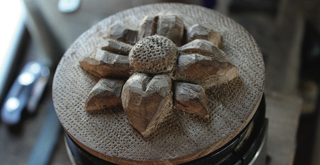 Wooden flower carving on round block