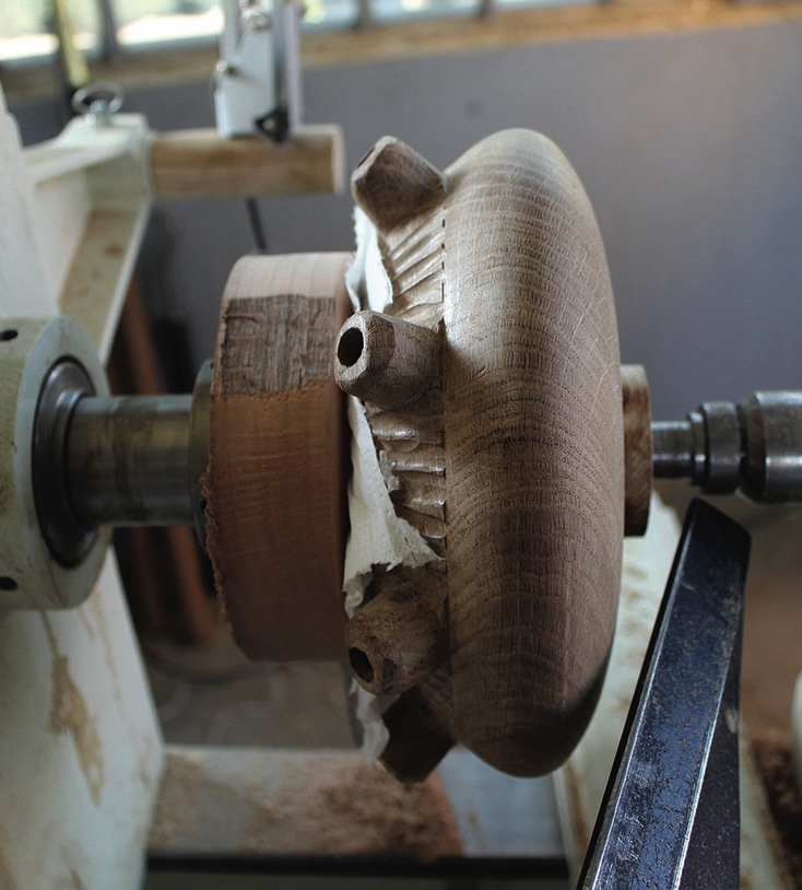 Wooden bowl in progress on lathe machine.
