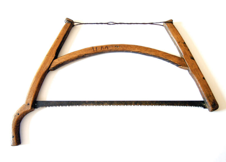 Traditional wooden bow saw with serrated blade