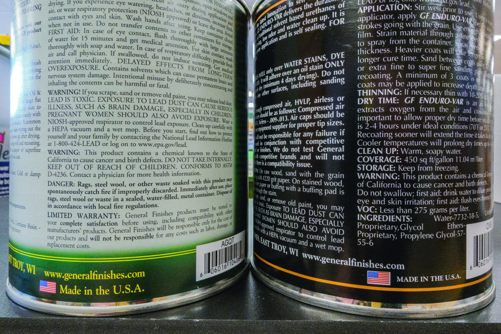 Warning labels on chemical product cans, close-up view.