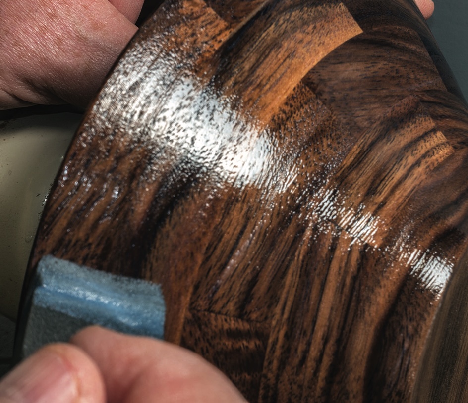 Polishing wooden surface with sponge