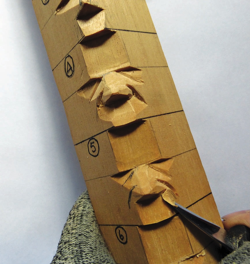 Wood carving technique on numbered block.