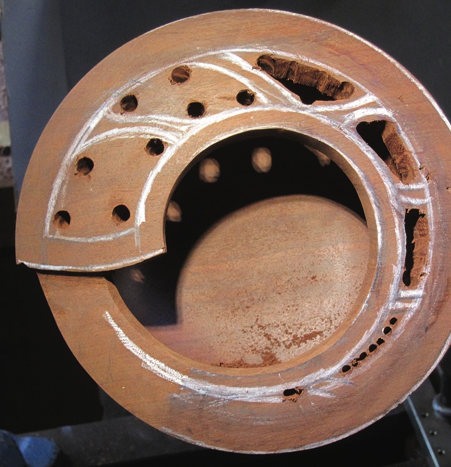 Woodturned bowl with intricate carved design.