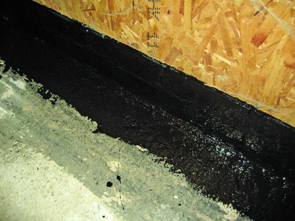Foundation damp proofing with black waterproof coating
